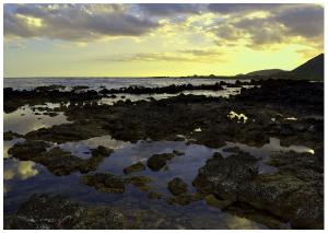 Sunset in rocky seashore